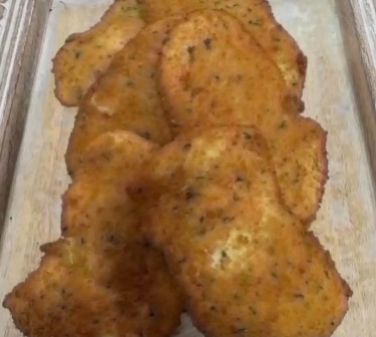 A tray of golden breaded cutlets from Il Porcellino